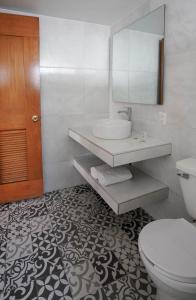 a bathroom with a sink and a toilet and a mirror at Hotel New York Ciudad de Mexico in Mexico City +23 photos