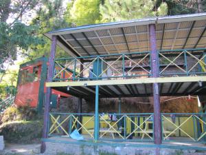 a building with a roof on top of it at Pine Ridge 4-Person Tent in Pleasing Prospect
