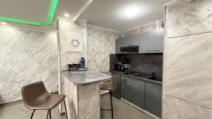 a small kitchen with a counter and a sink at Nid d'Amour in Strasbourg