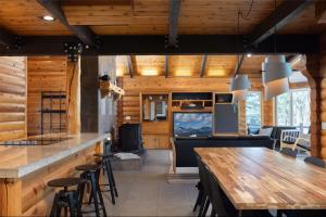 a restaurant with a bar with a table and chairs at Sisters Cabin in Sisters