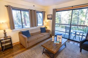 a living room with a couch and a table at Inside Yosemite Park-Cozy Corner Unit-Sleeps 2 in Yosemite West
