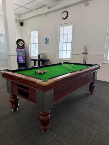 a pool table in a room with afits at Grafton Hotel in Grafton