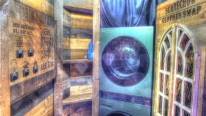 a door in a room with a washing machine at Luminary Lodge in Sevierville +30 photos