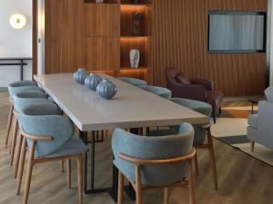 a dining room with a table and chairs at NOVOTEL KOLWEZI in Kolwezi +102 photos