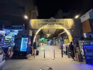 a welcome sign at a market at night at Horus key Nile View in Aswan