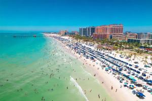 an aerial view of a beach with people in the water at Beach getaway - Private paradise - Clearwater in Clearwater