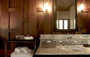 a bathroom with a sink and a mirror at Burasari Heritage Luang Prabang in Luang Prabang +30 photos