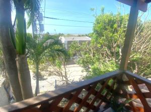 a view from the balcony of a house with palm trees at Apartaestudio con balcón cerca al mar in Puerto Colombia +2 photos