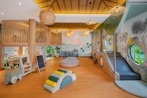 a childrens room with a play area with a slide at The St. Regis Bali Resort in Nusa Dua +155 photos