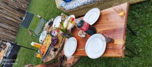 a picnic table with plates of food on it at The Beleza Suites in Kericho +32 photos