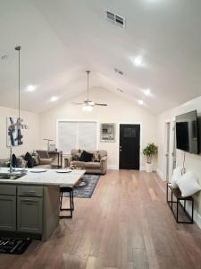 an open living room with a kitchen and a living room at Xscapecatio Oasis II in Tulsa