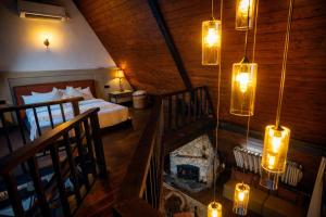 a bedroom with a bed and a fireplace in a room at Kubana in Nuwara Eliya +51 photos