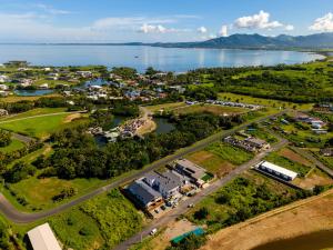 an aerial view of a town next to a lake at Tides Apartments in Nadi