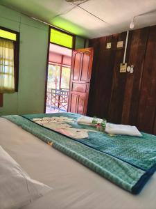 a close up of a bed in a room at Noupad sunset Guesthouse in Don Det