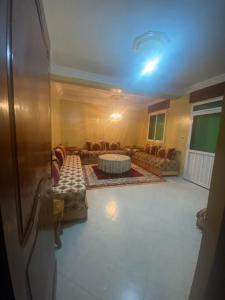 a living room with a couch and a table at Balcon atlantico in Larache