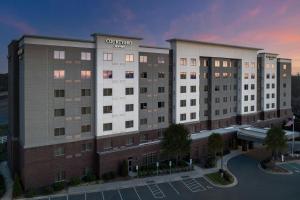 an architectural rendering of a hotel building at Courtyard by Marriott Charlotte Northlake in Charlotte