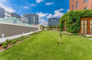 an artificial lawn with agility equipment in a building at 54 on Bath, Johannesburg Rosebank in Johannesburg
