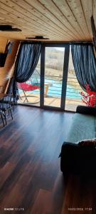 a large room with a bed and a large window at Colorful Space in Kotoraantkari