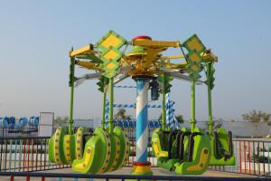 a ride in a amusement park with a roller coaster at Amazing Fun World By Nexottel in Dwarka