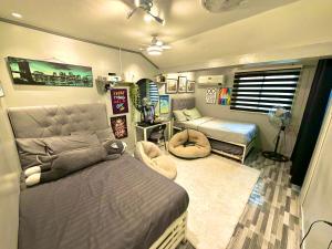 a bedroom with two beds and a room with a bed sqor at The White Haven In Clark ENTIRE HOUSE in Angeles