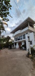 a large white building with a lot of windows at Bohol Panglao Paradise Villa in Panglao Island