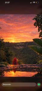 a view of a sunset from a television screen at Imperial Emerald House in Muzo