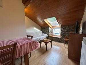 a living room with a couch and a window at Cal Pascual Turisme Rural in Les Pereres