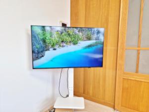 a flat screen tv hanging on a wall at Cozystay-Beomeo in Hyomoktong-Ilgu