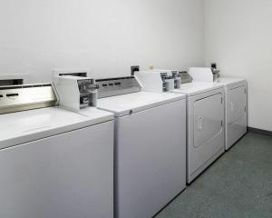 a row of white washing machines in a room at Quality Inn Ingleside - Corpus Christi in Ingleside