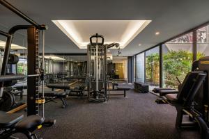 an empty gym with a bunch of treadmills and machines at Sheraton Cascais Resort - Hotel & Residences in Cascais