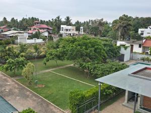an aerial view of a yard with trees and houses at Amadel Negombo in Negombo