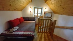 a living room with a couch and a staircase at Biohof Prannleithen - Knusperhaus in Yspertal