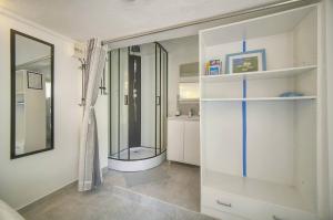 a bathroom with a glass shower in a room at FRGK "4 Suites Privées Exclusives" in Cannes +76 photos