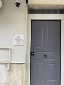 a door to a house with a blue door at Terrasolemonica in Pontecorvo