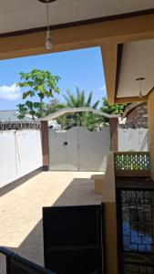 a kitchen with a view of a patio at Zai Homes Watamu in Watamu