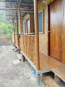 a house being constructed with wooden posts at C and C Place in San Vicente