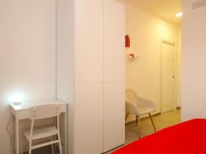 a bedroom with a bed and a desk and a chair at Affittacamere 1888 in Pietrelcina +13 photos