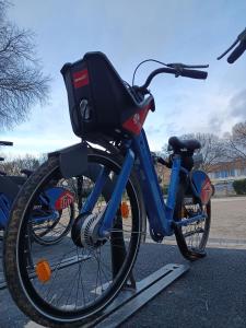 a bike is parked in a parking lot at Le Nid du Rossignol in Nîmes