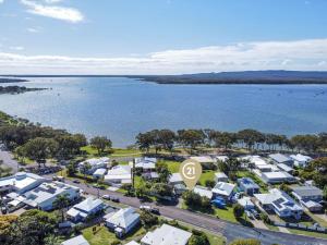 an aerial view of a city with a lake at Welcome to Seascapes in Tin Can Bay
