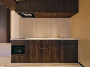 a kitchen with a sink and a counter top at illi Eme Tokyo-Toranomon in Tokyo