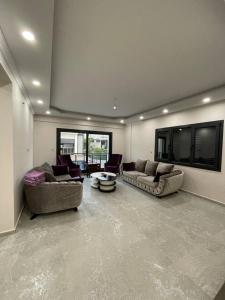 a large living room with two couches and a tv at Master Vi in Dalaman