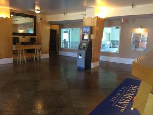a restaurant with a ticket machine in the middle of a room at Baymont by Wyndham Lawrenceburg in Lawrenceburg