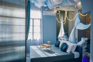 a childs bedroom with a bed with a mermaid theme at Fairytale Athens - Luxury Suites in Athens