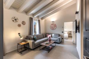 a living room with a couch and a table at Seety Spartaco in Milan