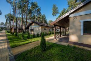 a house with a yard with trees and a building at Park-Hotel Tihiy Les in Prokhorovka