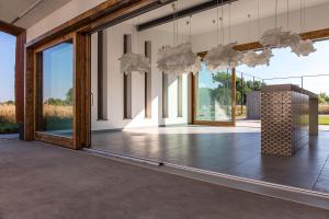 a large room with large windows and a dance floor at Artkazal in Mórahalom