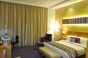 Postel nebo postele na pokoji v ubytování Fortune Park Hotel