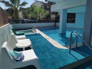 a swimming pool on the roof of a building at Akman City Hotel in Kuşadası