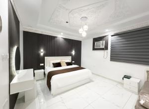 a bedroom with a bed and a sink in it at مرافئ in Medina