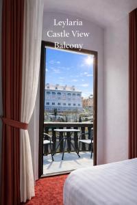 a hotel room with a view of a balcony at Leylaria in Český Krumlov